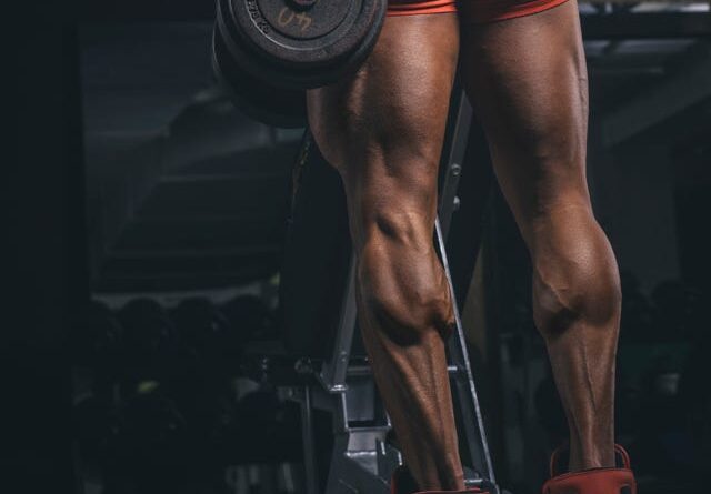 Bodybuilder training calves in the gym